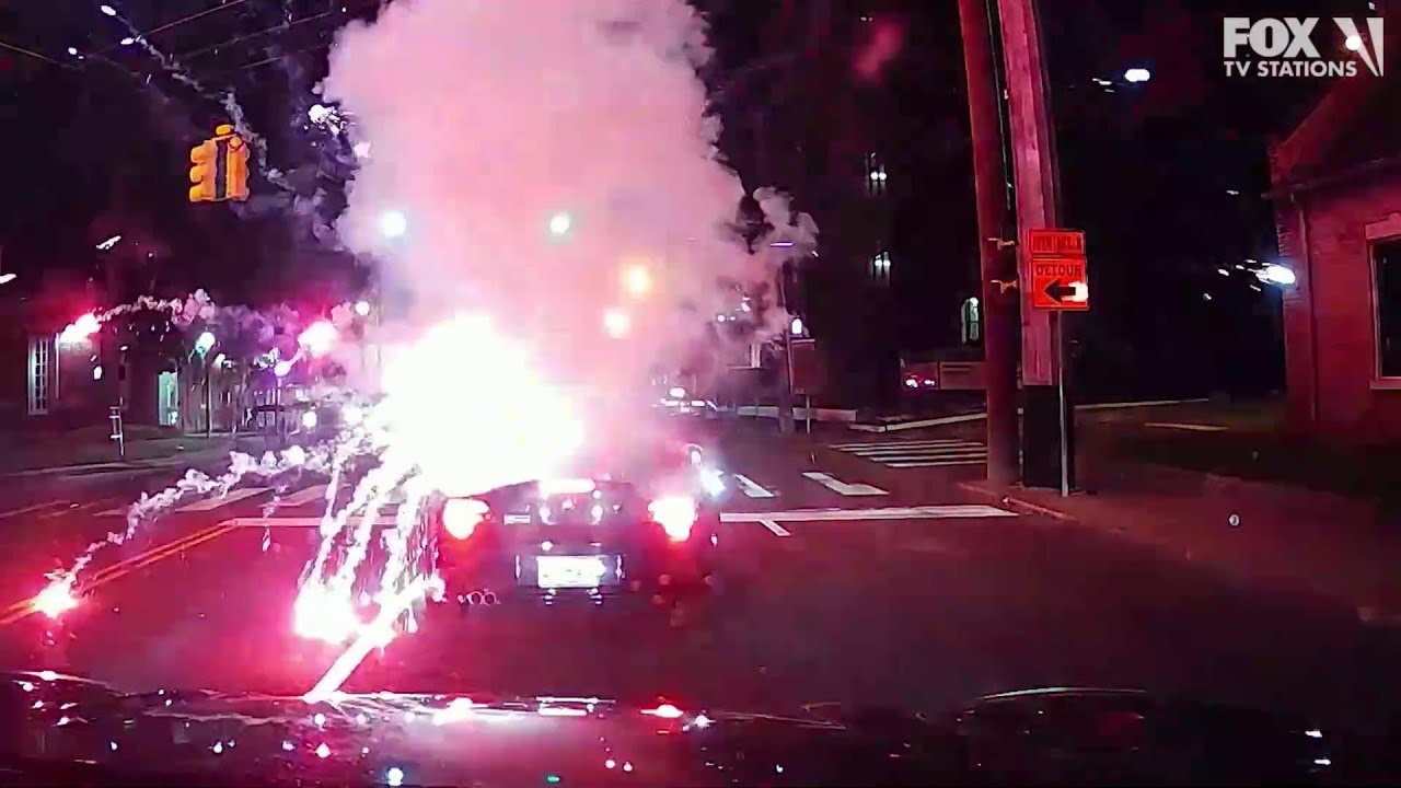 Driver Throws Lit Fireworks Into Open Convertible