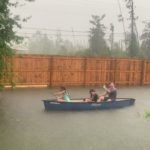 Family Turns Flooded Backyard Into Canoe Fun