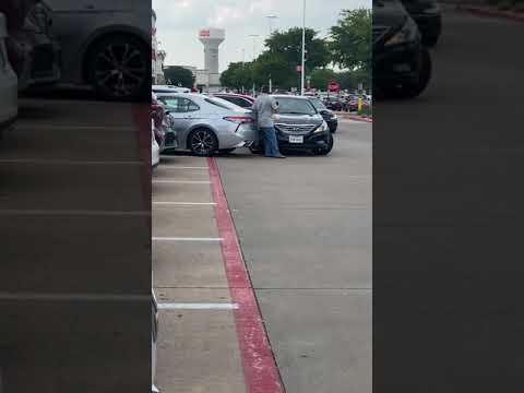 Watch This Bonkers Hit And Run Parking Dispute!