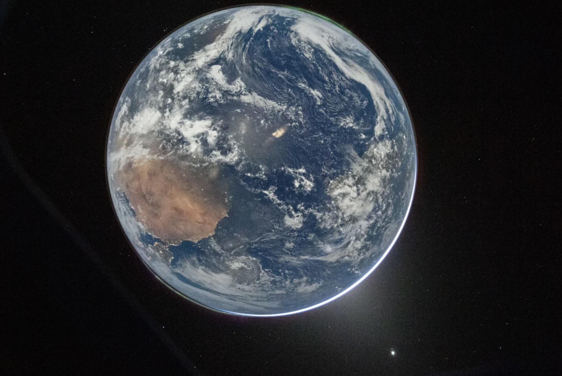 A photo of Earth taken from Artemis II's Orion capsule. / Credit: NASA/Reid Wiseman